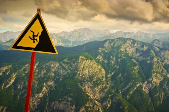 Man falling from mountain sign