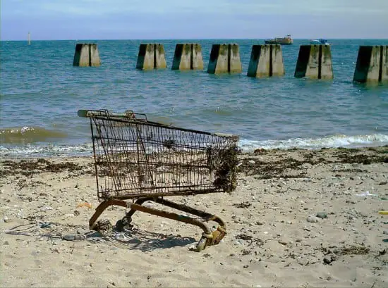 An ineffective shopping cart on the beach