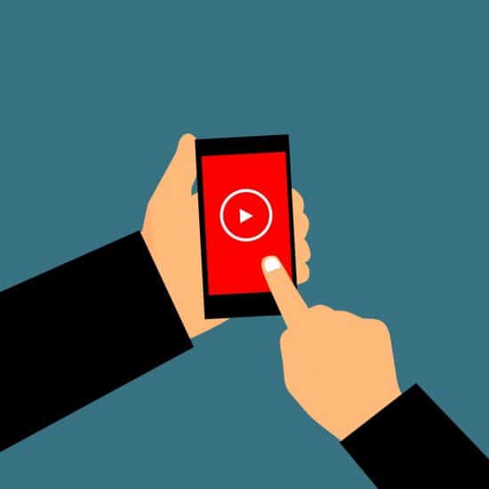 Animated person touching an iPhone screen to play video