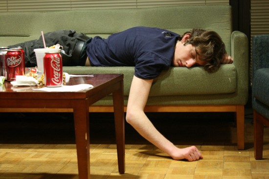 Person passed out on couch Person passed out on couch