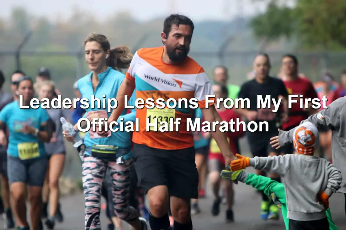 Half marathon runner high-fiving children