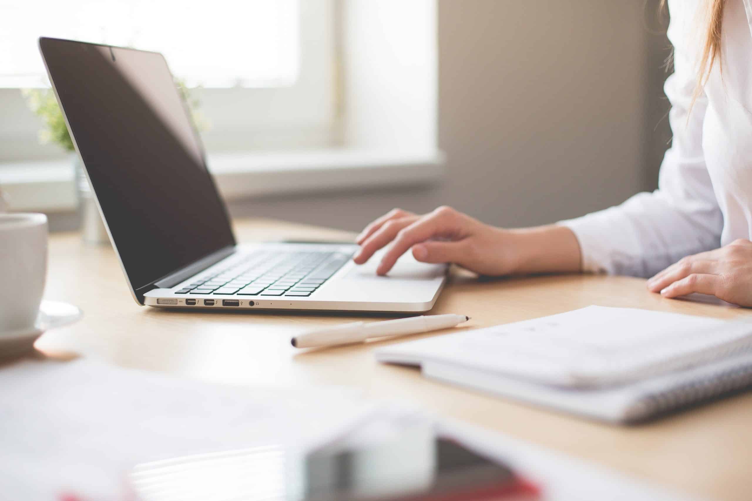 Woman working on a MacBook Pro laptop