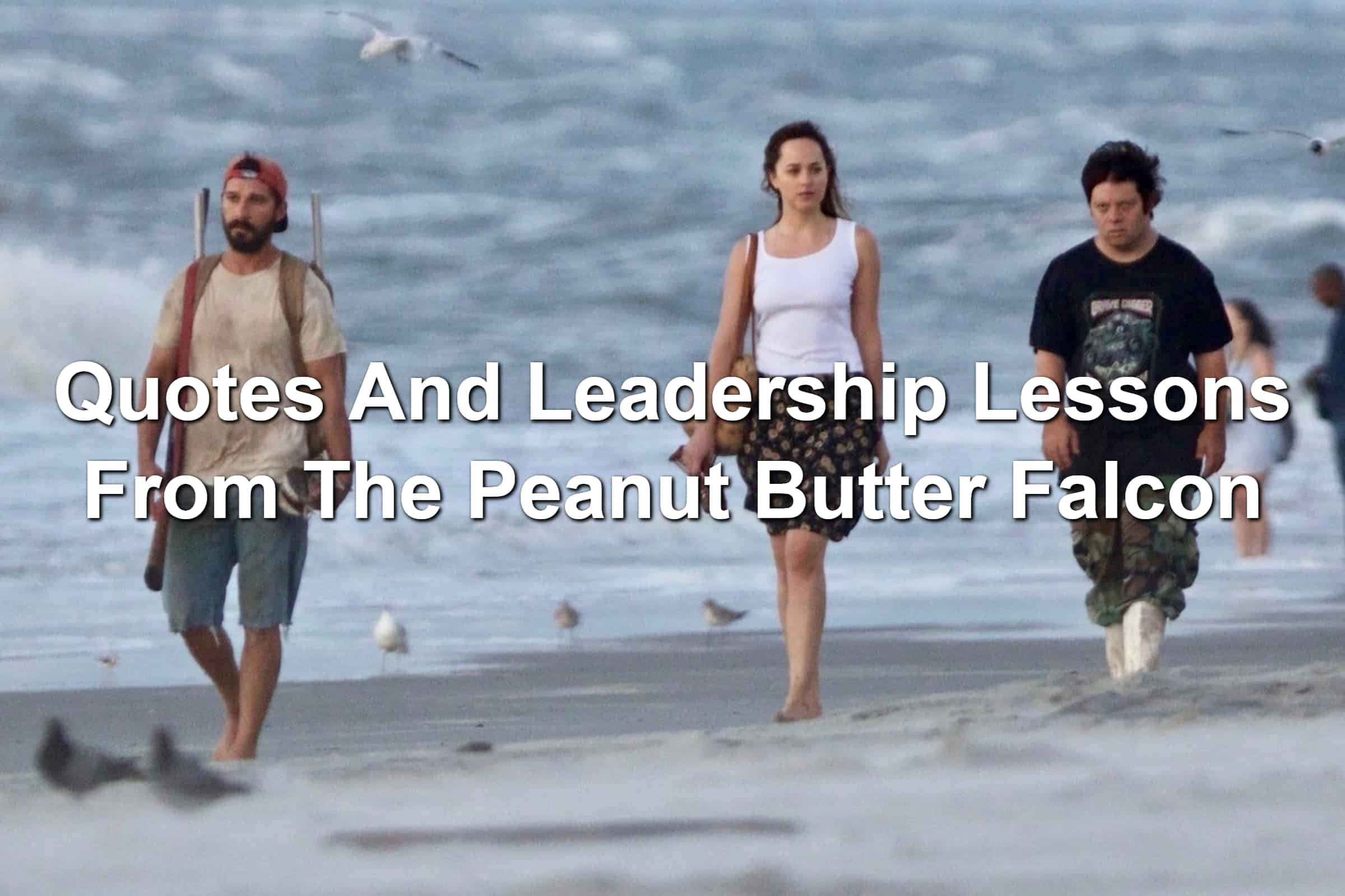 Shia LeBeouf, Dakota Johnson, and Zack Gottsagen walking along a beach in The Peanut Butter Falcon