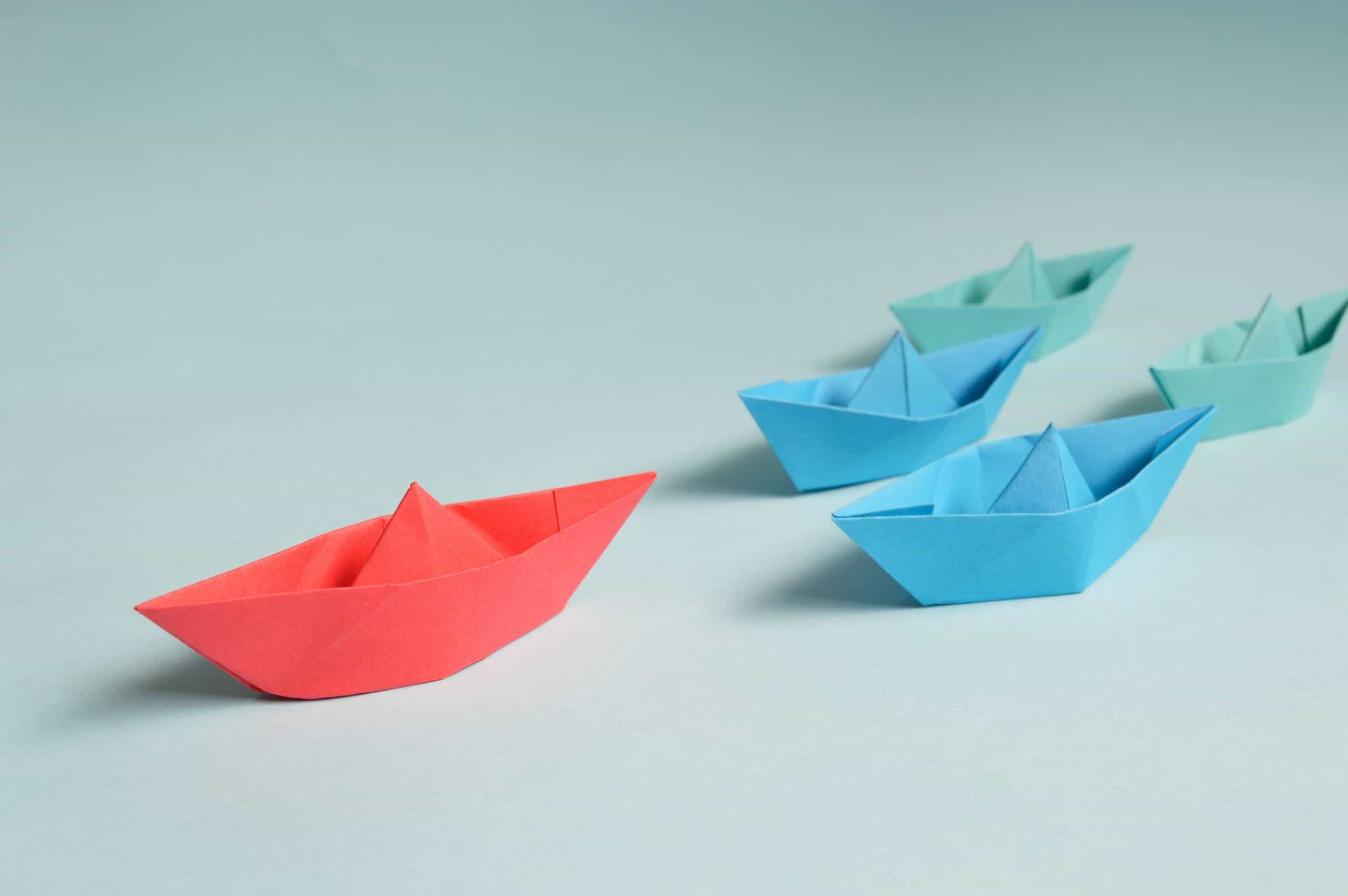 Blue and red origami boats