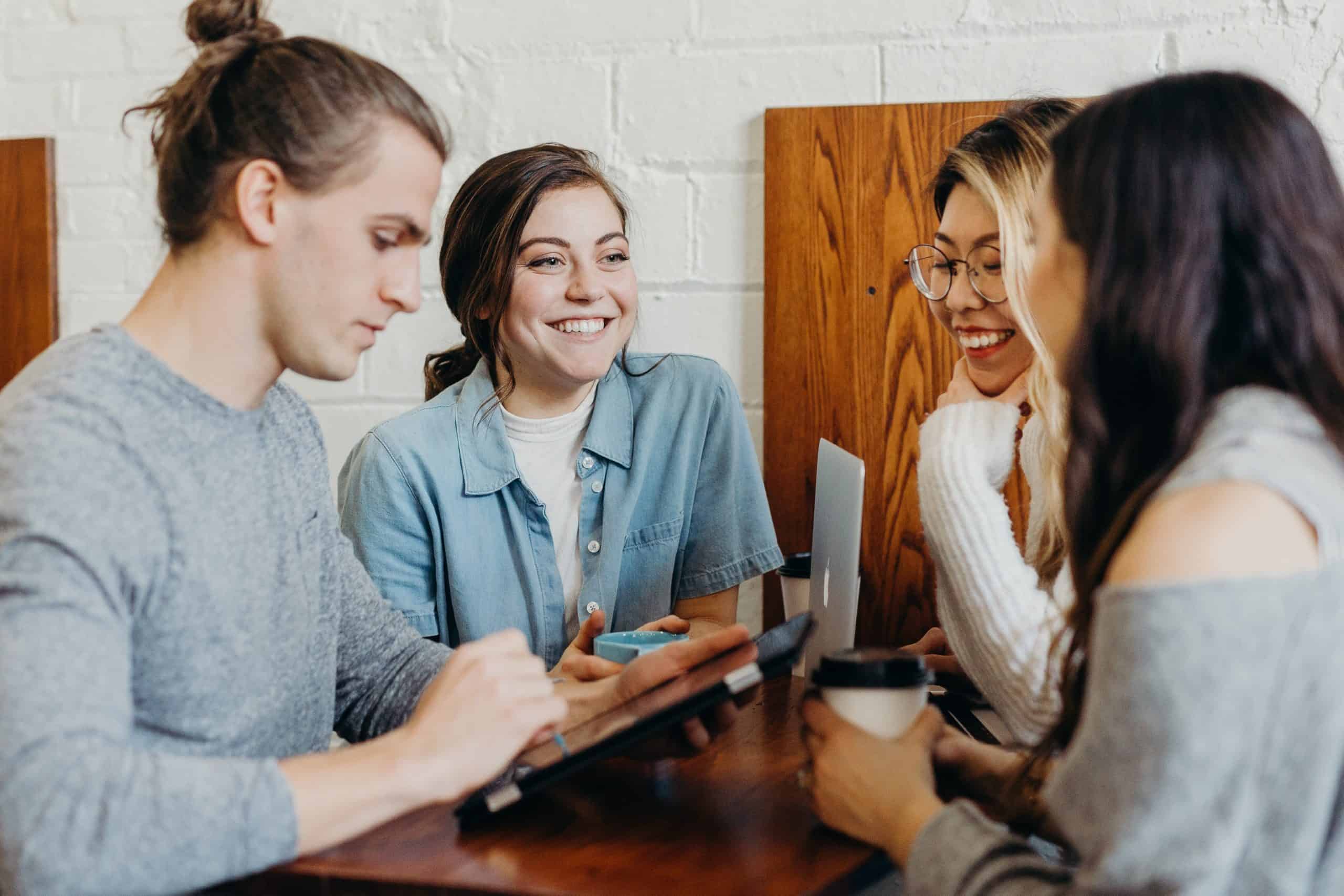 Employees gathered around a table