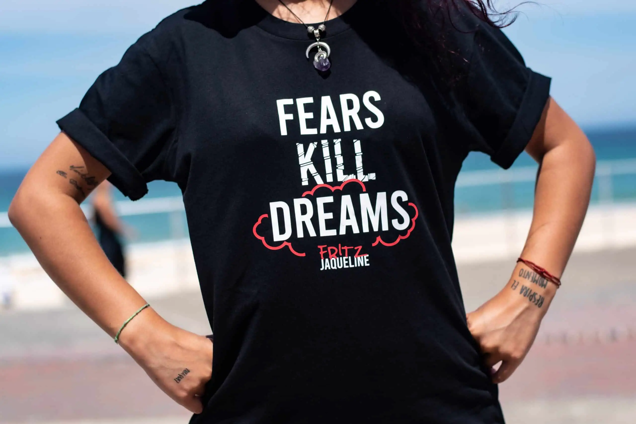 Woman in a shirt that says Fears kill dreams - Overcoming fear
