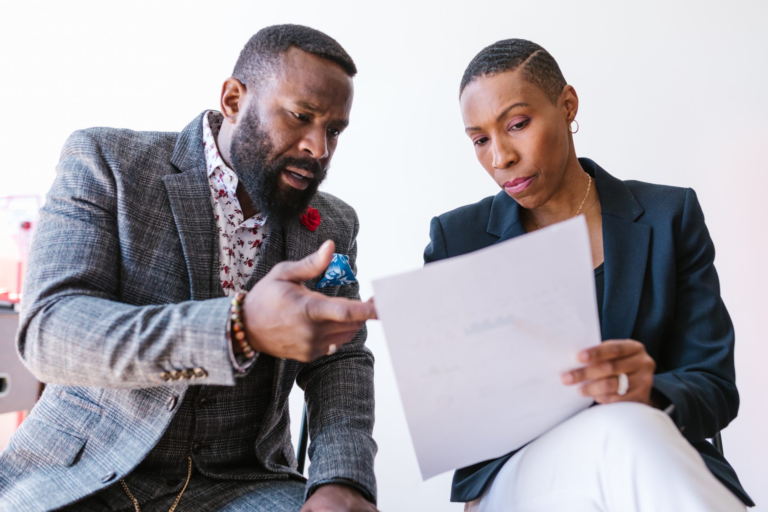 Two people looking at a piece of paper