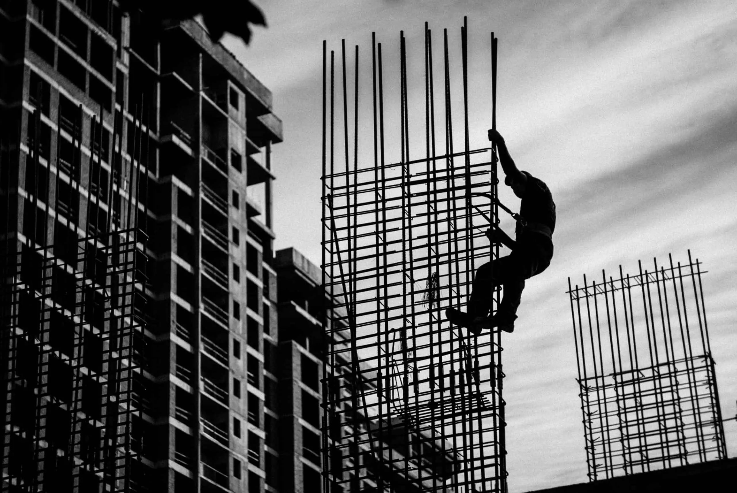 Man climbing construction scaffolding