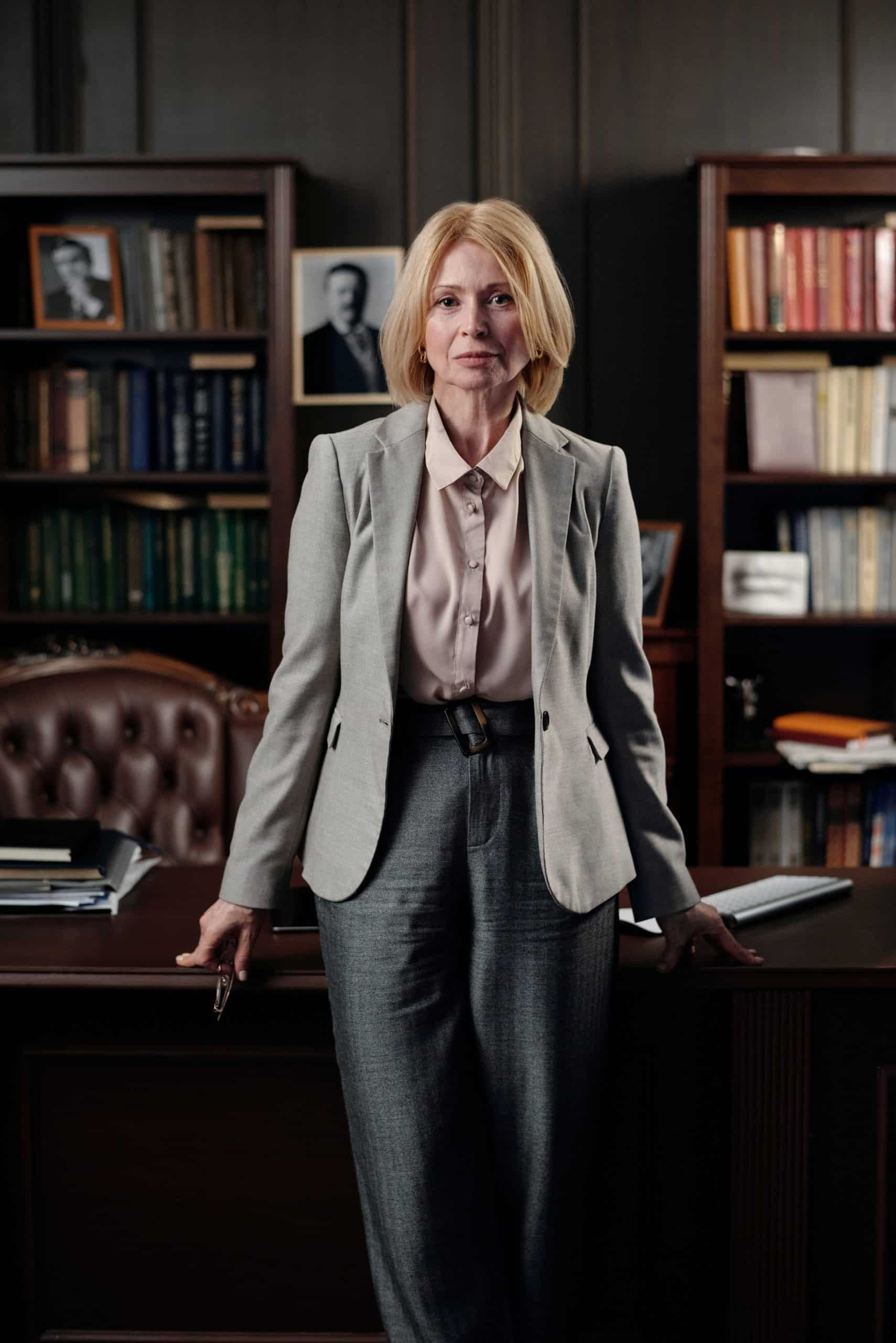 Woman standing in front of desk