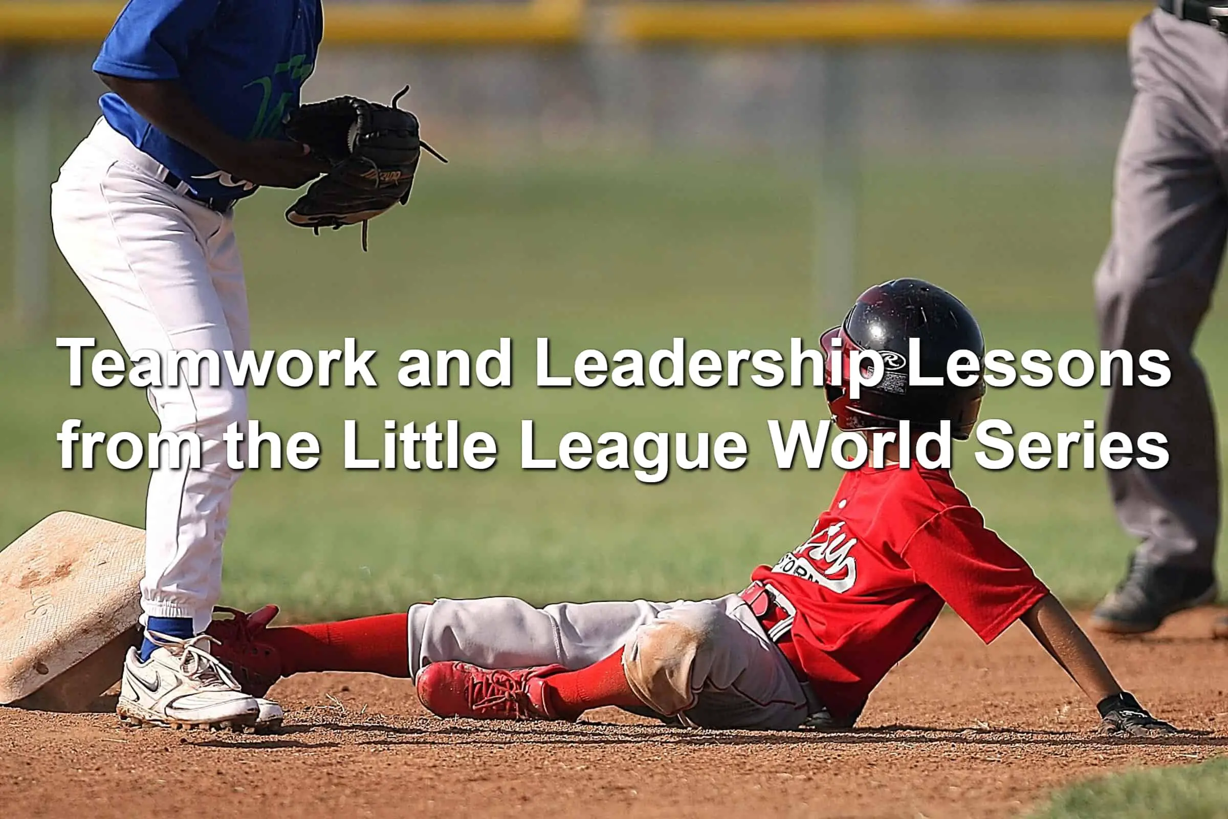 Little league baseball player sliding into a base