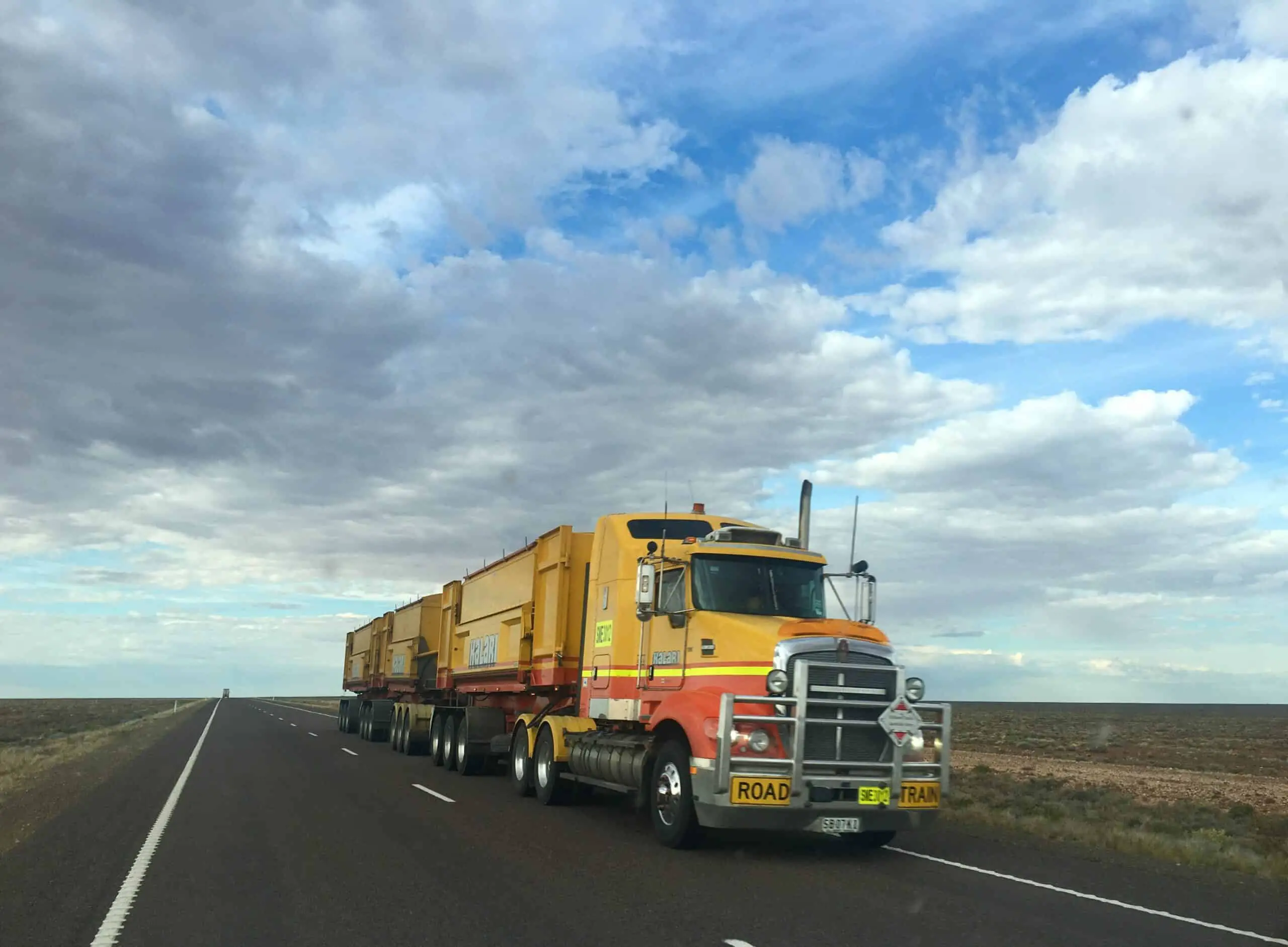 Yellow semi-truck on a highway