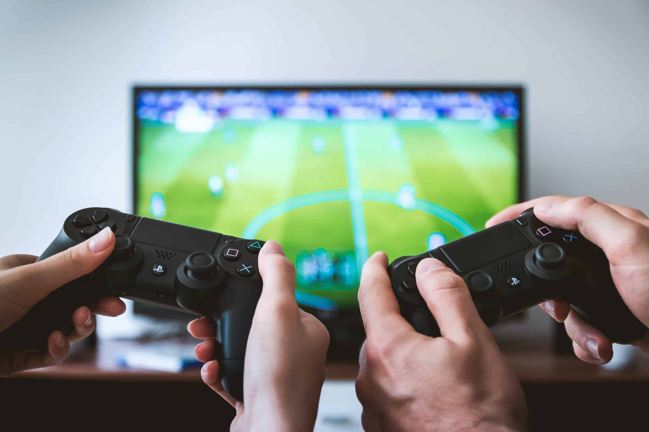 People holding video game controllers