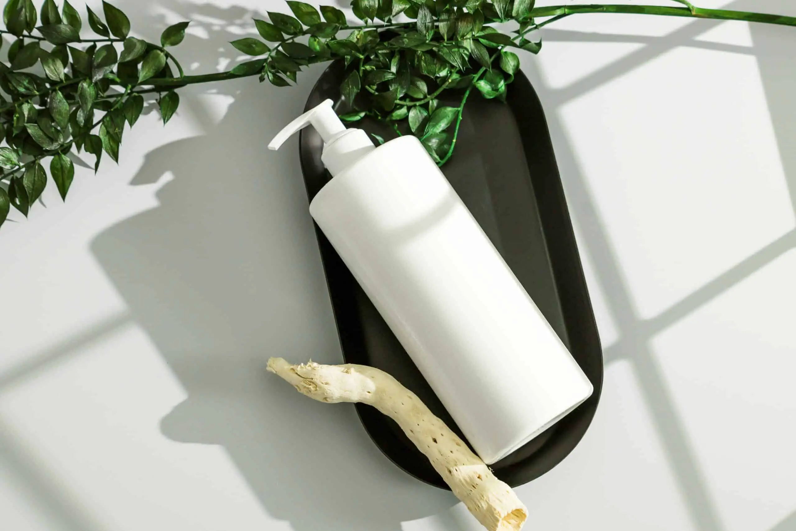 White cosmetic bottle on a table