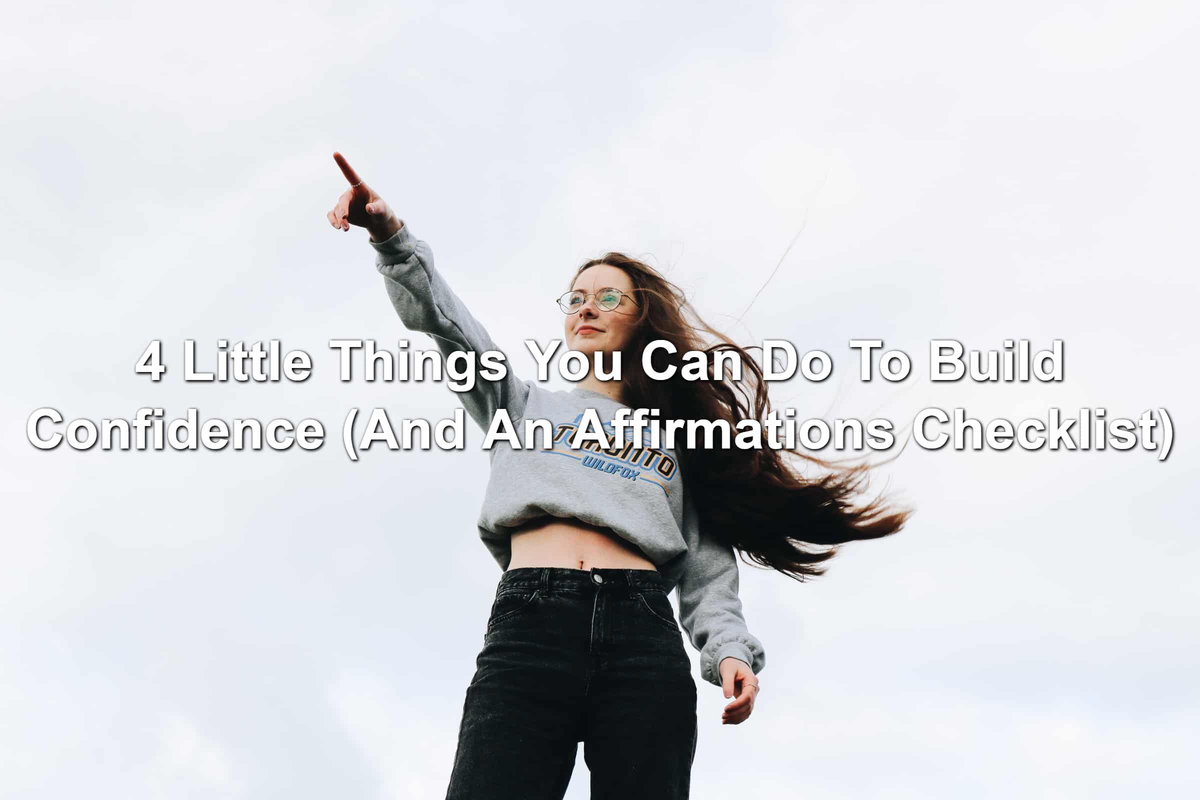 Woman pointing toward the sky