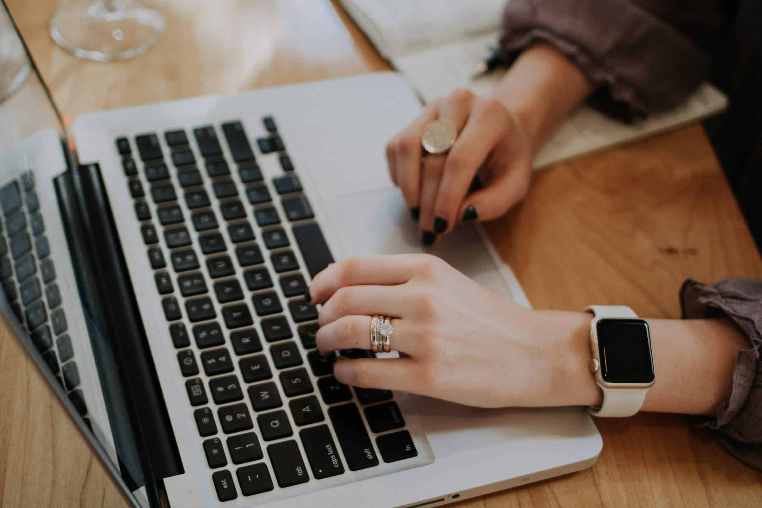 Woman typing on a laptop