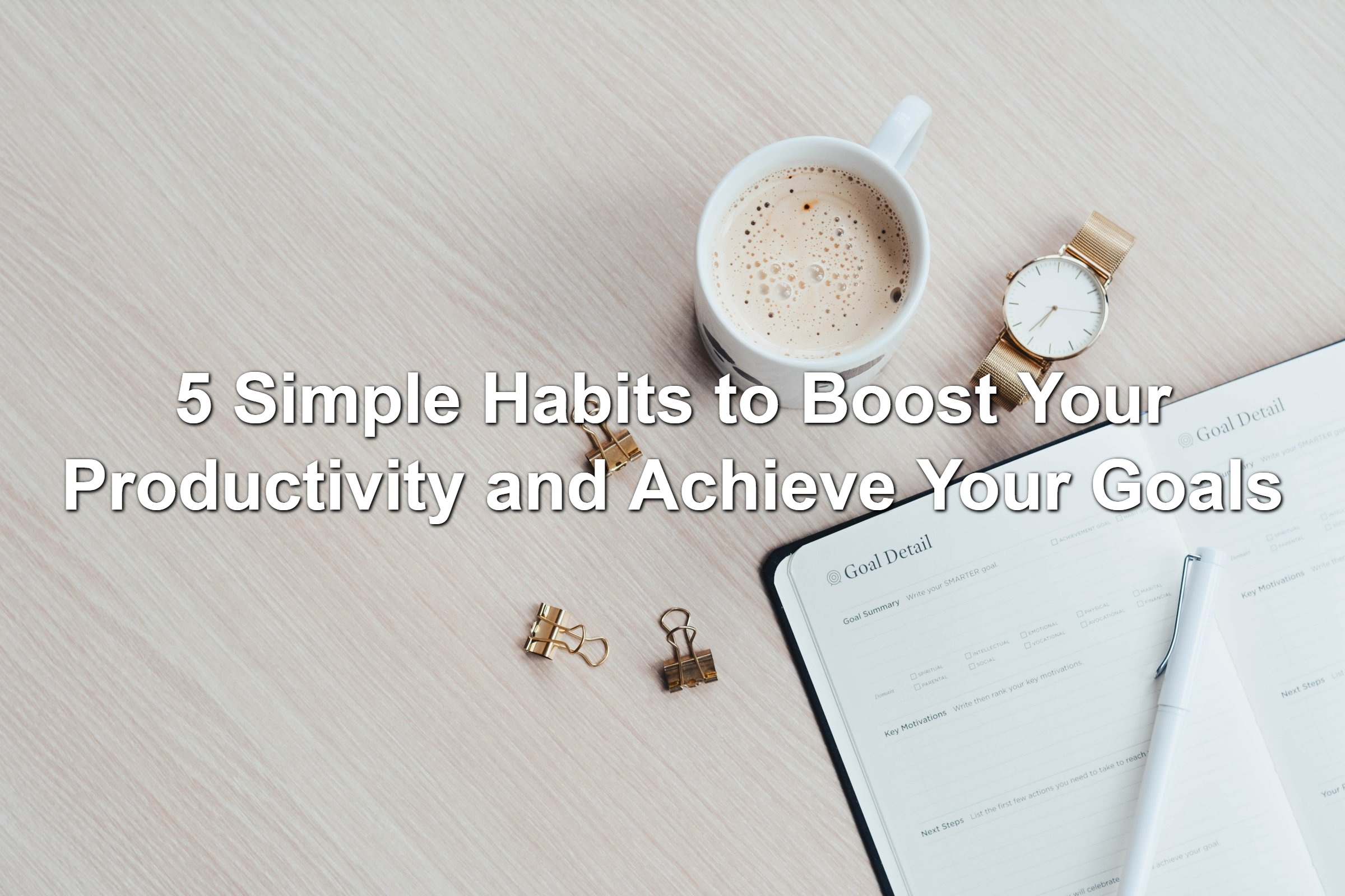 Coffee and paper planner on a white table