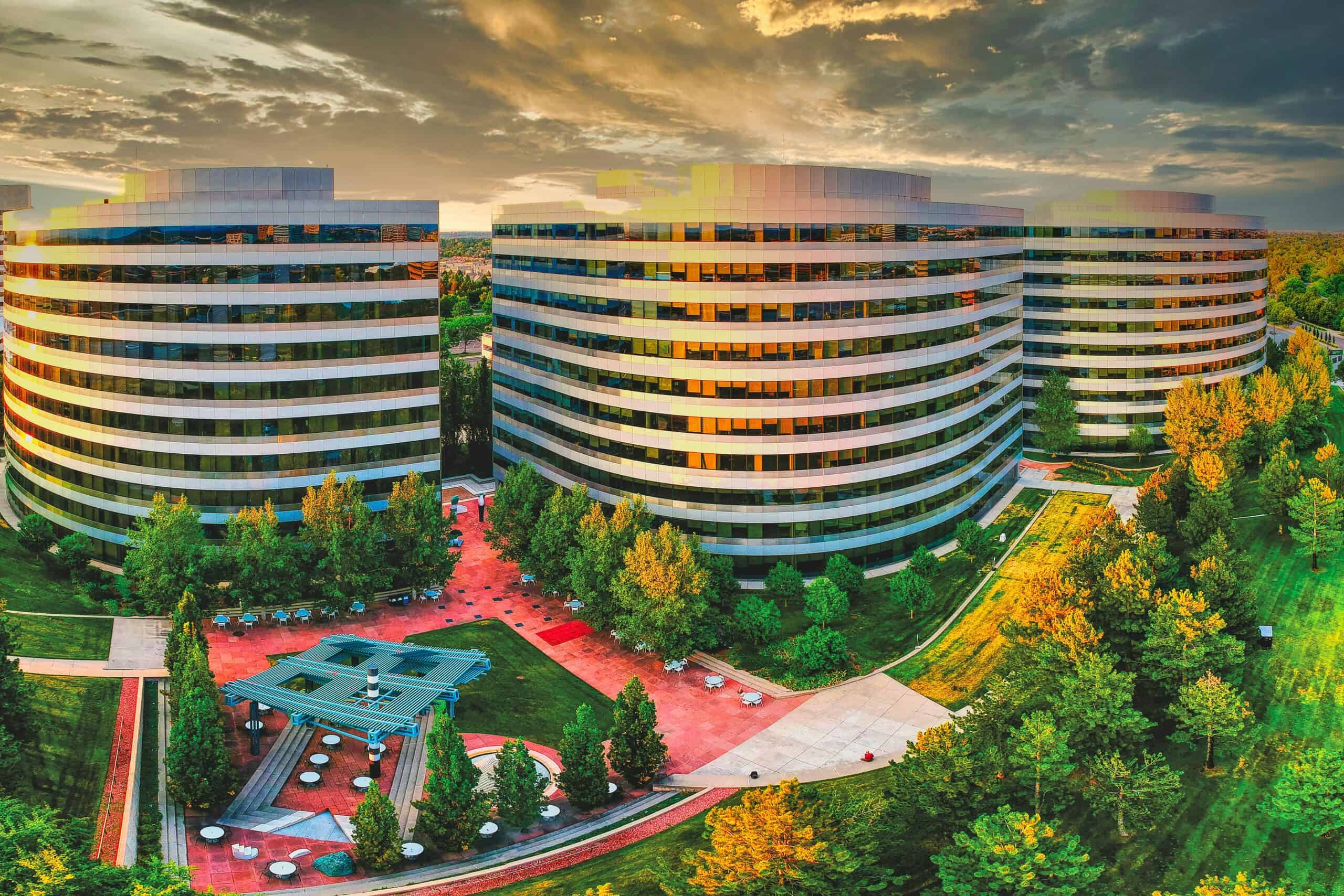 high rise building near green trees under white clouds during daytimeAerial of Great West triplex in Denver Tech Center