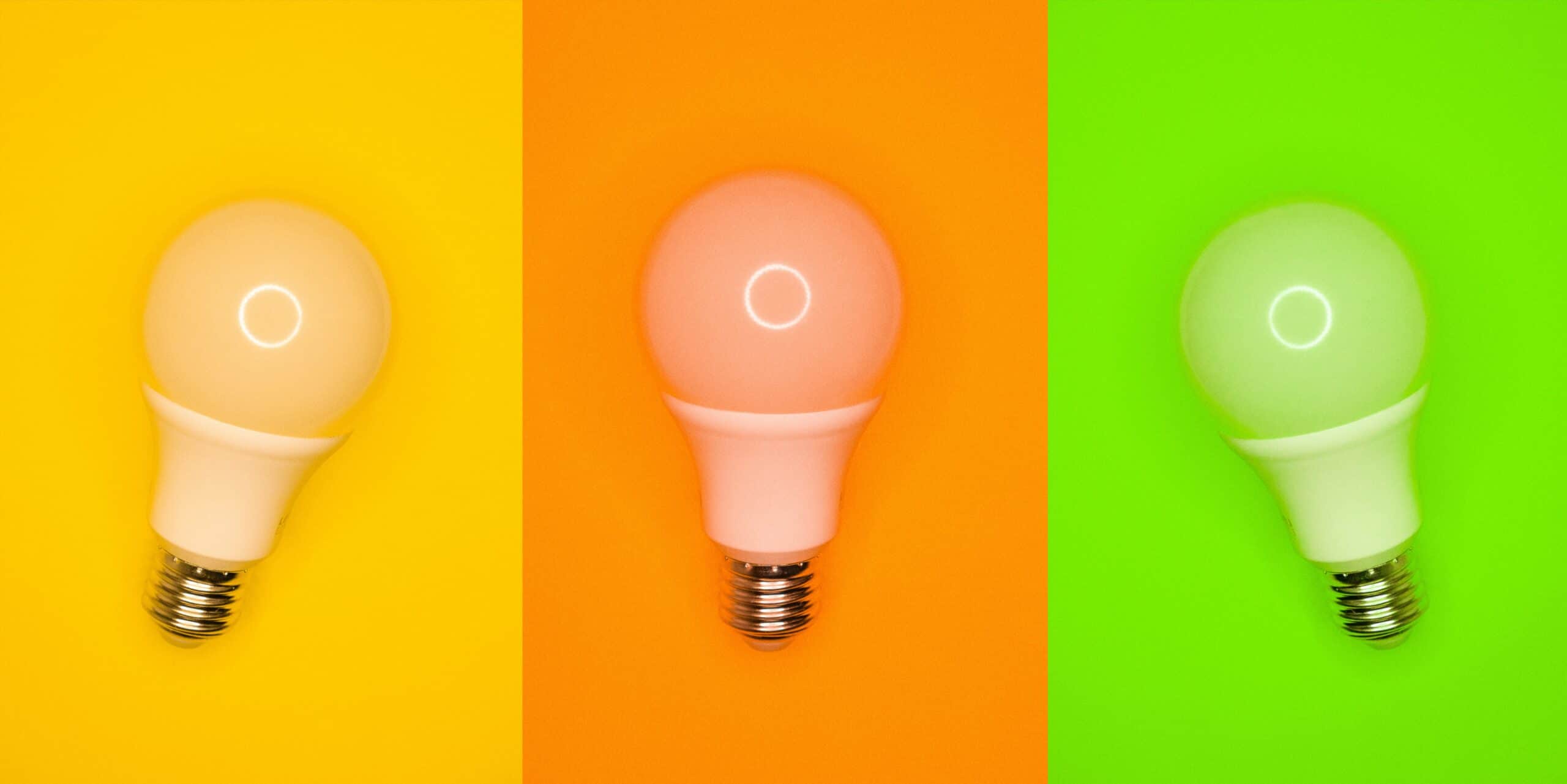 Three light bulbs. Each have a different background. One yellow, orange, and green.
